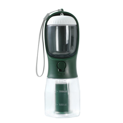 Green and clear portable pet water bottle with a strap on a white background